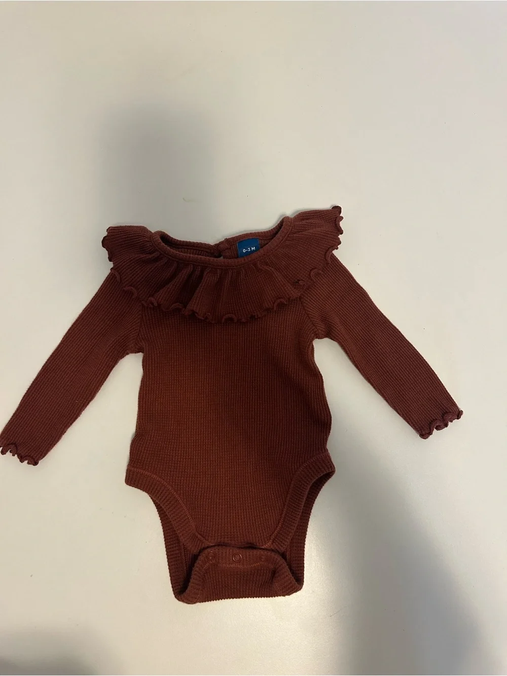 Rust Ruffle Neck Ribbed Baby Onesie